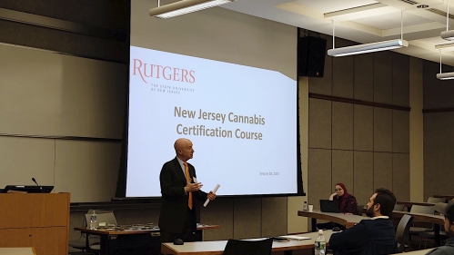 Professor teaching students in classroom