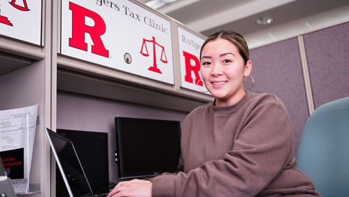 Woman working at laptop at desk