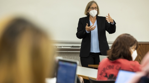 A female instructor leads a lecture at Rutgers Law School.
