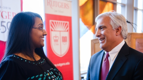 Two Rutgers Law alums chat at an alumni event.