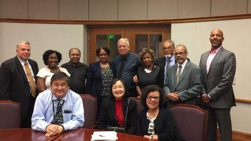 Representatives of MSP alumni drawn from the years 1971 through 1985. Standing: Hon. Alberto Rivas '85, Yvonne Segars '84, David Harris '79, Margarita Echevarria '77, Felipe Chavana '76, Patricia Weston Rivera  '78, Alan Dexter Bowman '76, Norman Epting '79, Hon. Thomas W. Sumners, Jr. '84. Seated: Dean Ronald K. Chen '83, Hon. Sue Pai Yang '84, MSP Dean Yvette Bravo-Weber.