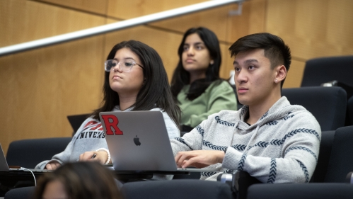 Students pay attention to an instructor during a lecture.