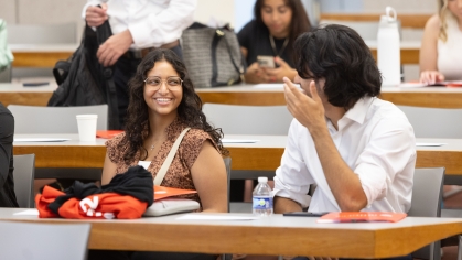 Two students talking in class.