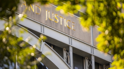 Close up of ‘Justice’ word on law school building