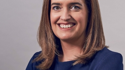woman in blue smiling