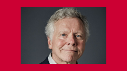 man smiling in middle square with red surrounding background