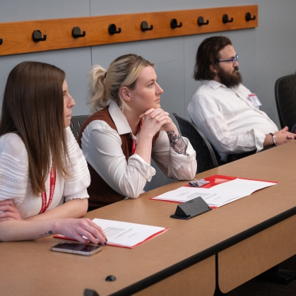 Part-time students listening in classroom. 