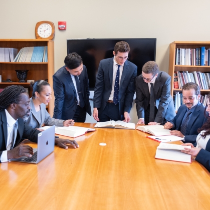 People working around a conference room table