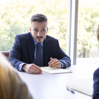 Man working with group of people at a table
