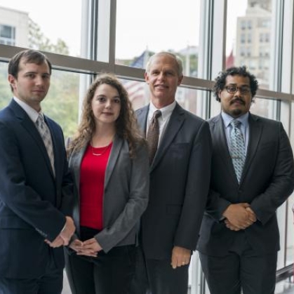 Group standing by window