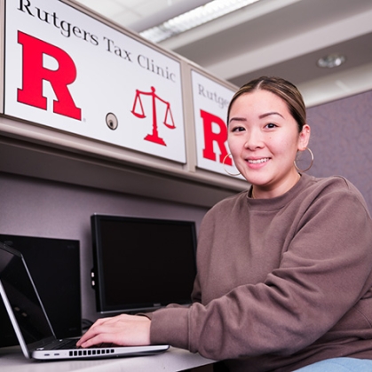 Woman working at laptop at desk