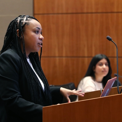 Student speaking at podium