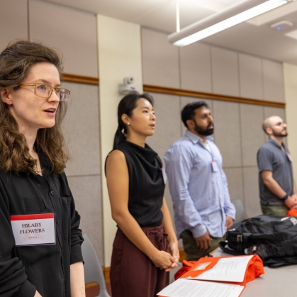 Students standing in a row in classroom