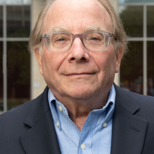man in glasses grinning
