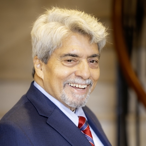 Man in blue suit smiling