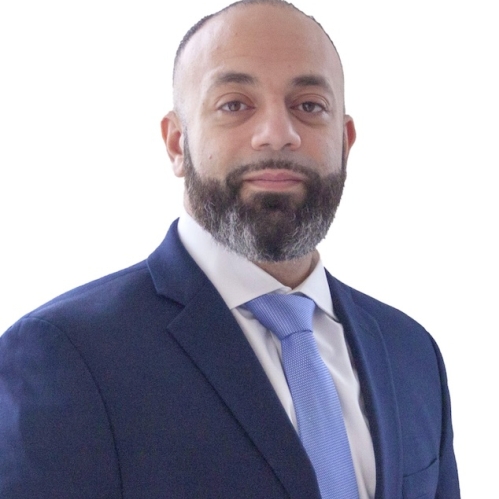 Man in blue suit and tie and white shirt