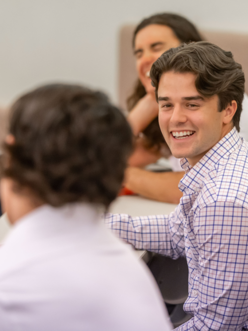 male students talking in class