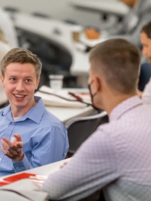 Male Students Talking in class with mask