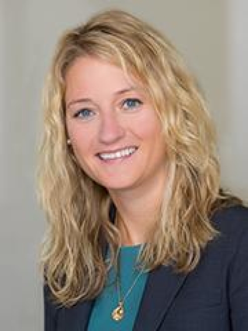A blonde woman smiling