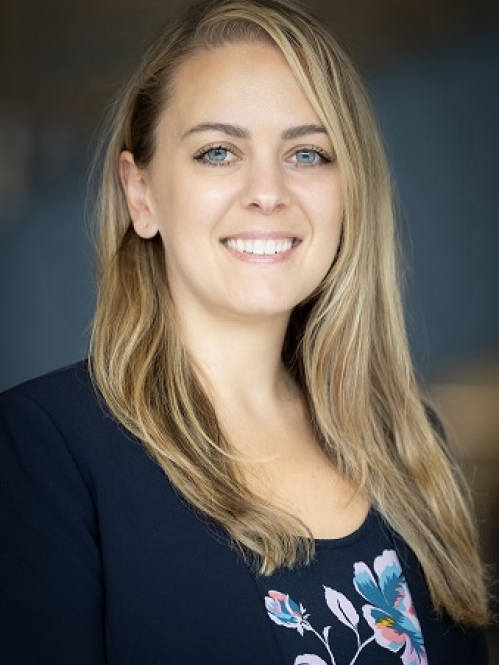 A blonde woman smiling