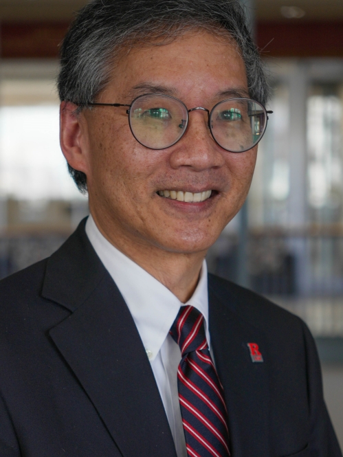 man with glasses smiling