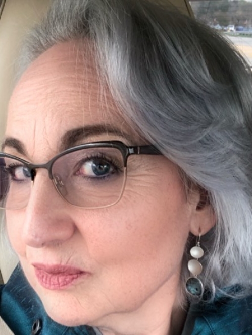 woman wearing glasses and smizing