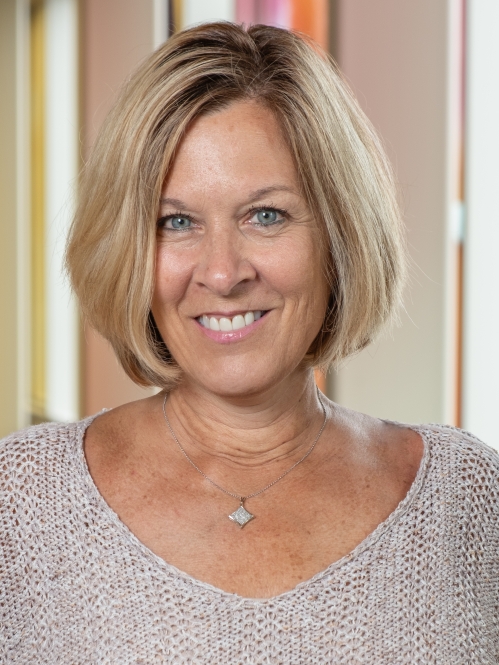 Woman grinning wearing knit top 