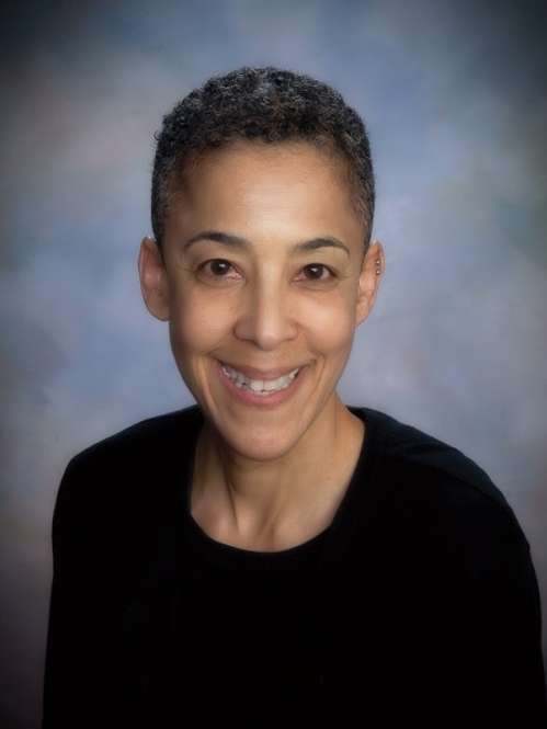 Woman smiling wearing black dress 