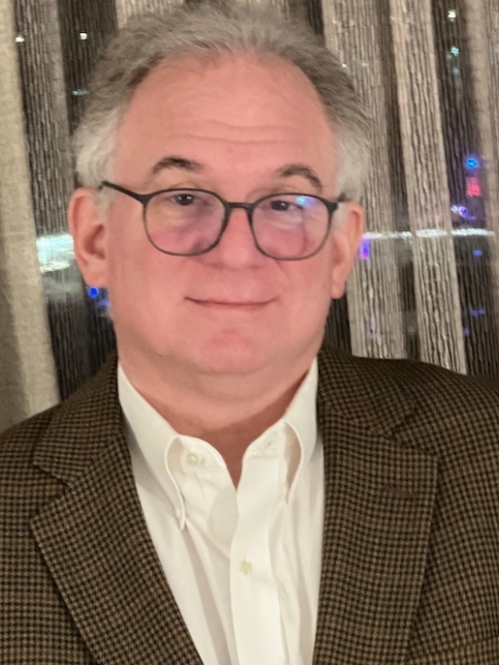 Man wearing glasses in front of window