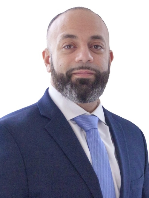 Man in blue suit and tie and white shirt