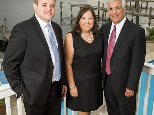 Joshua Bauers (left), the first post-graduate Maida Fellow, stands with James and Dr. Sharon Maida.